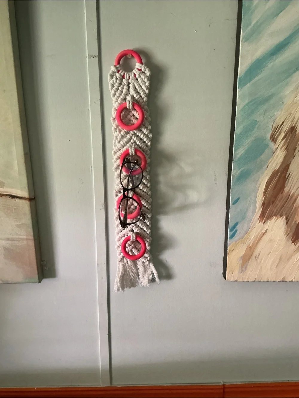 Handmade White Macramé Wall Organizer with Pink Rings